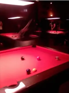 Sample photo: pool table under red light